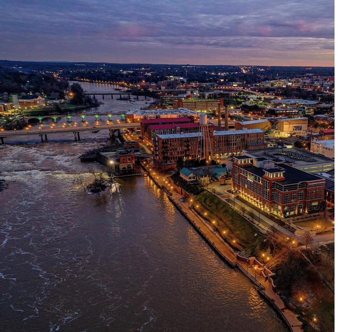 Aerial view of the Columbus, Georgia riverfront and Chattahoochee RiverWalk at dusk